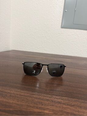 Black Oakley Metal Frame Sunglasses with Dark Lenses
